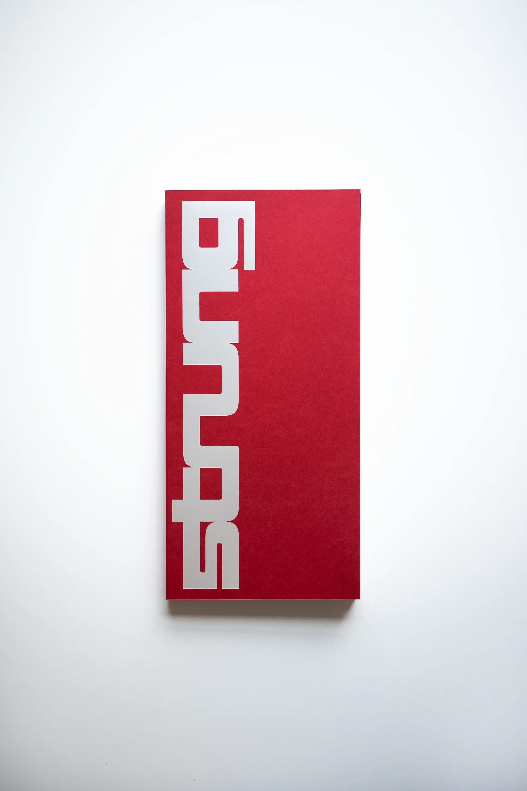 STRUNG: Issue 001 front cover, a red softcover with the STRUNG wordmark in silver foil
