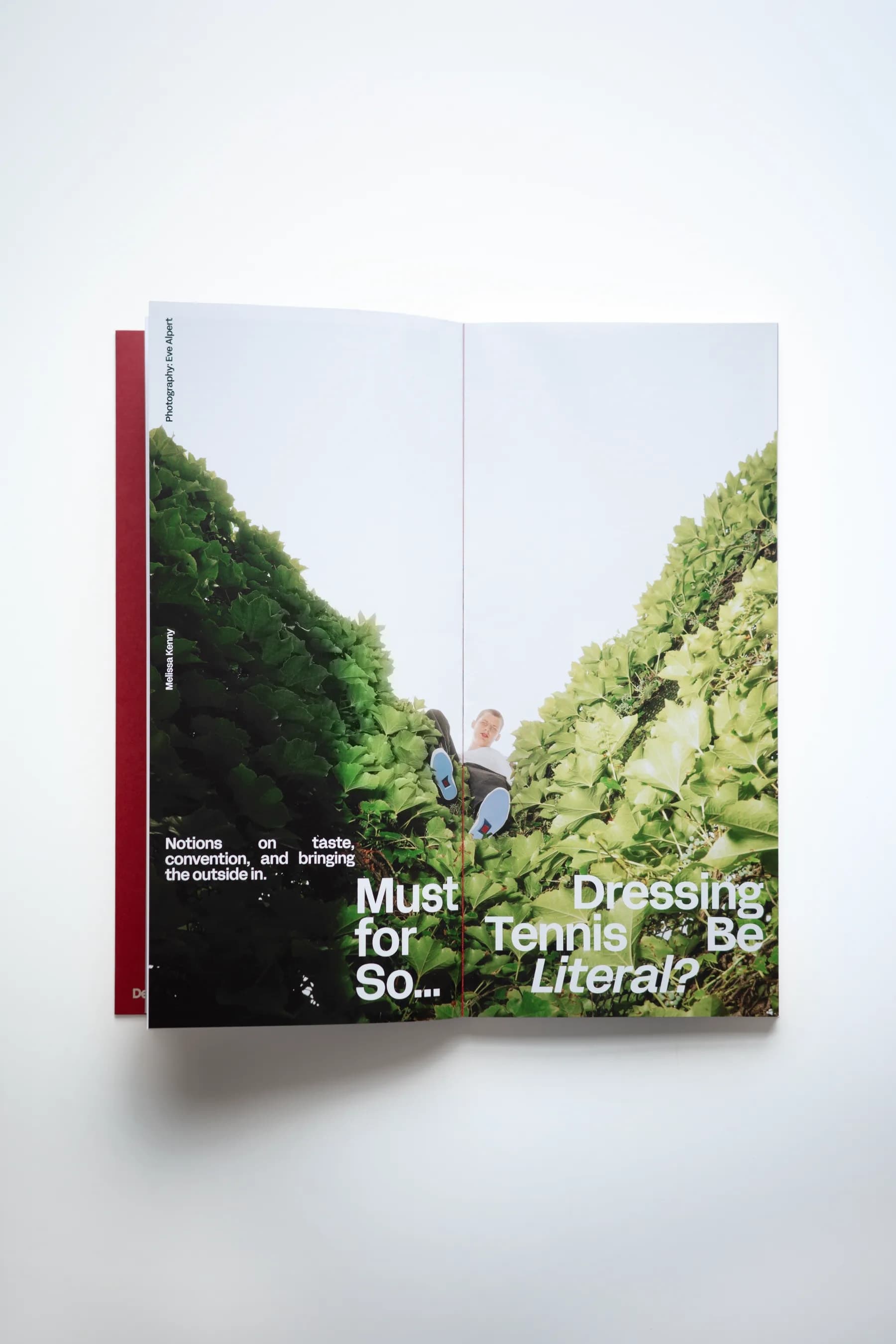STRUNG: Issue 001 opened to the “Must Dressing for Tennis Be So... Literal?” spread, a player photographed in dense green hedgerow
